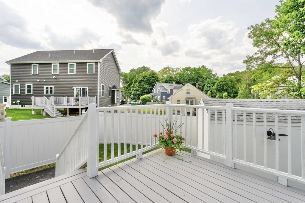 129 Watervale Road, Unit 129 Medford, MA 02155 - Photo 24 of 29 a view of a wooden deck and city view