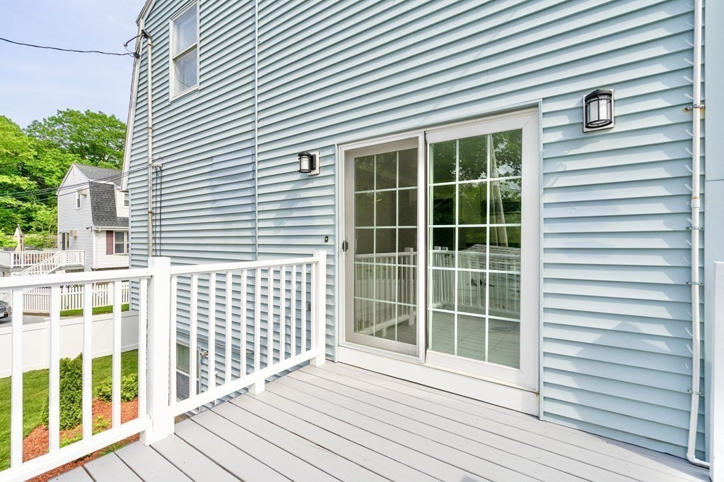 129 Watervale Road, Unit 129 Medford, MA 02155 - Photo 25 of 29 a view of a balcony with a window