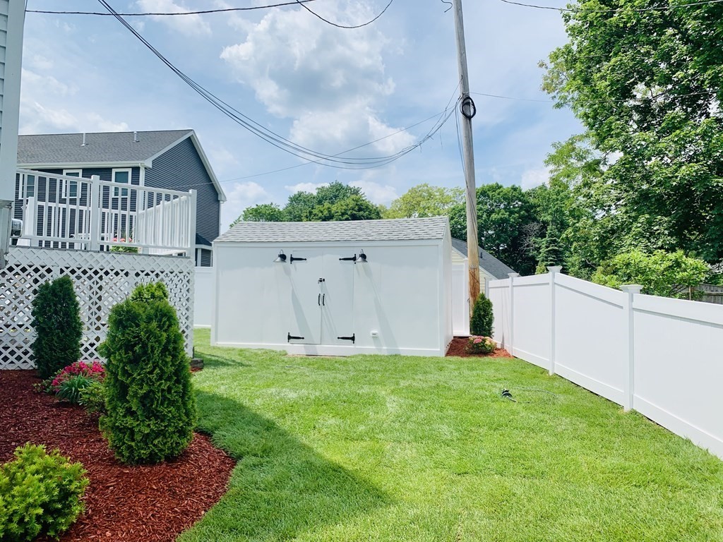 129 Watervale Road, Unit 129 Medford, MA 02155 - Photo 26 of 29 a view of a house with backyard and garden