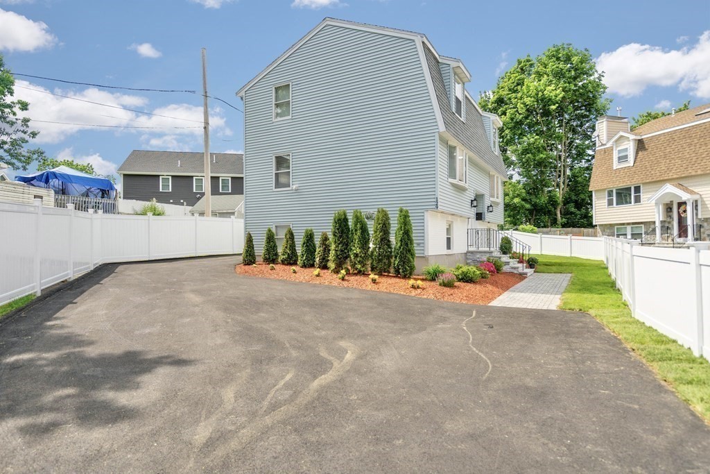 129 Watervale Road, Unit 129 Medford, MA 02155 - Photo 29 of 29 a view of a house with a patio