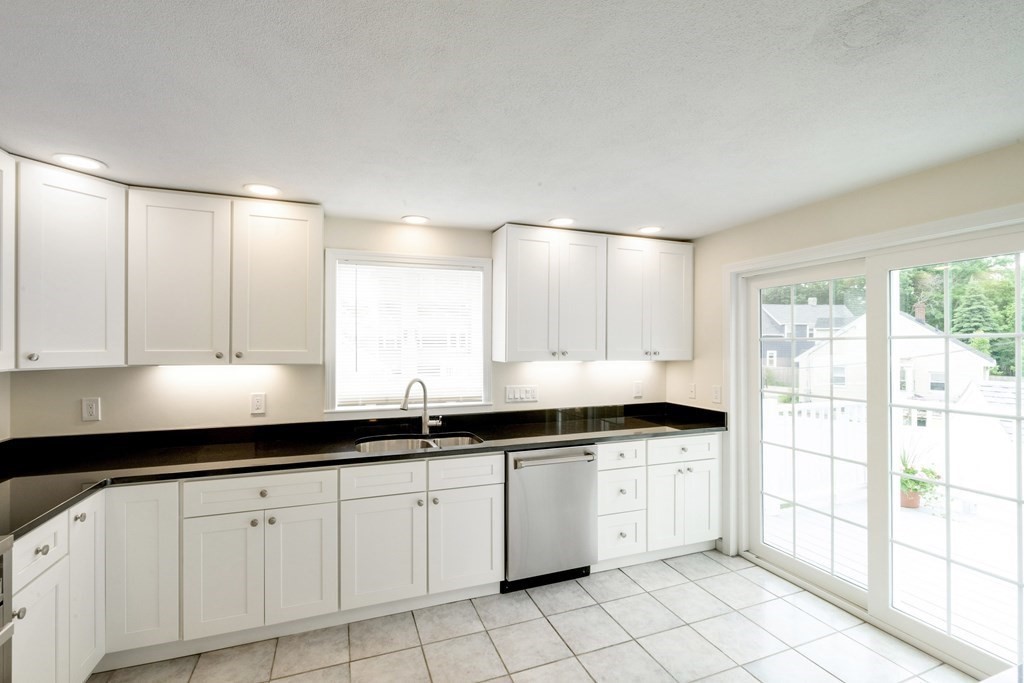 129 Watervale Road, Unit 129 Medford, MA 02155 - Photo 3 of 29 a kitchen with a sink and cabinets