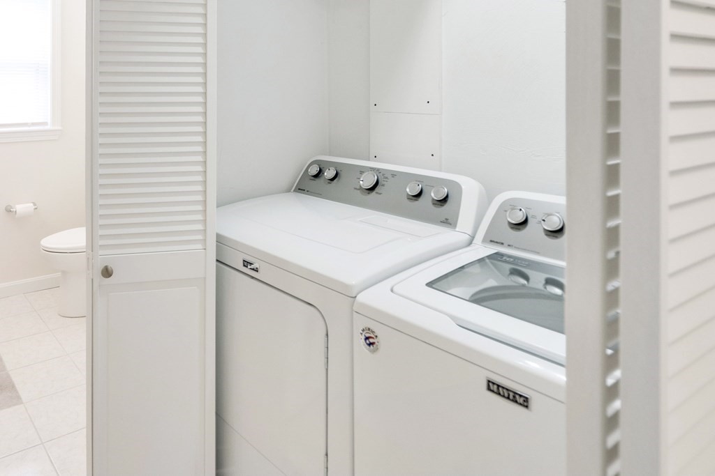 129 Watervale Road, Unit 129 Medford, MA 02155 - Photo 7 of 29 a utility room with dryer and washer