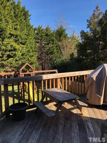 swimming pool view with a seating space