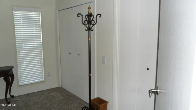 a view of a hallway with a window