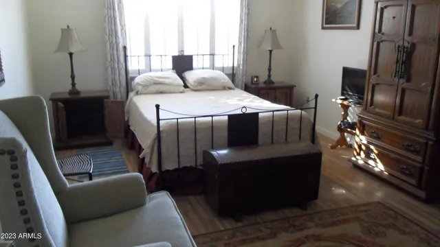 a bedroom with furniture and a window