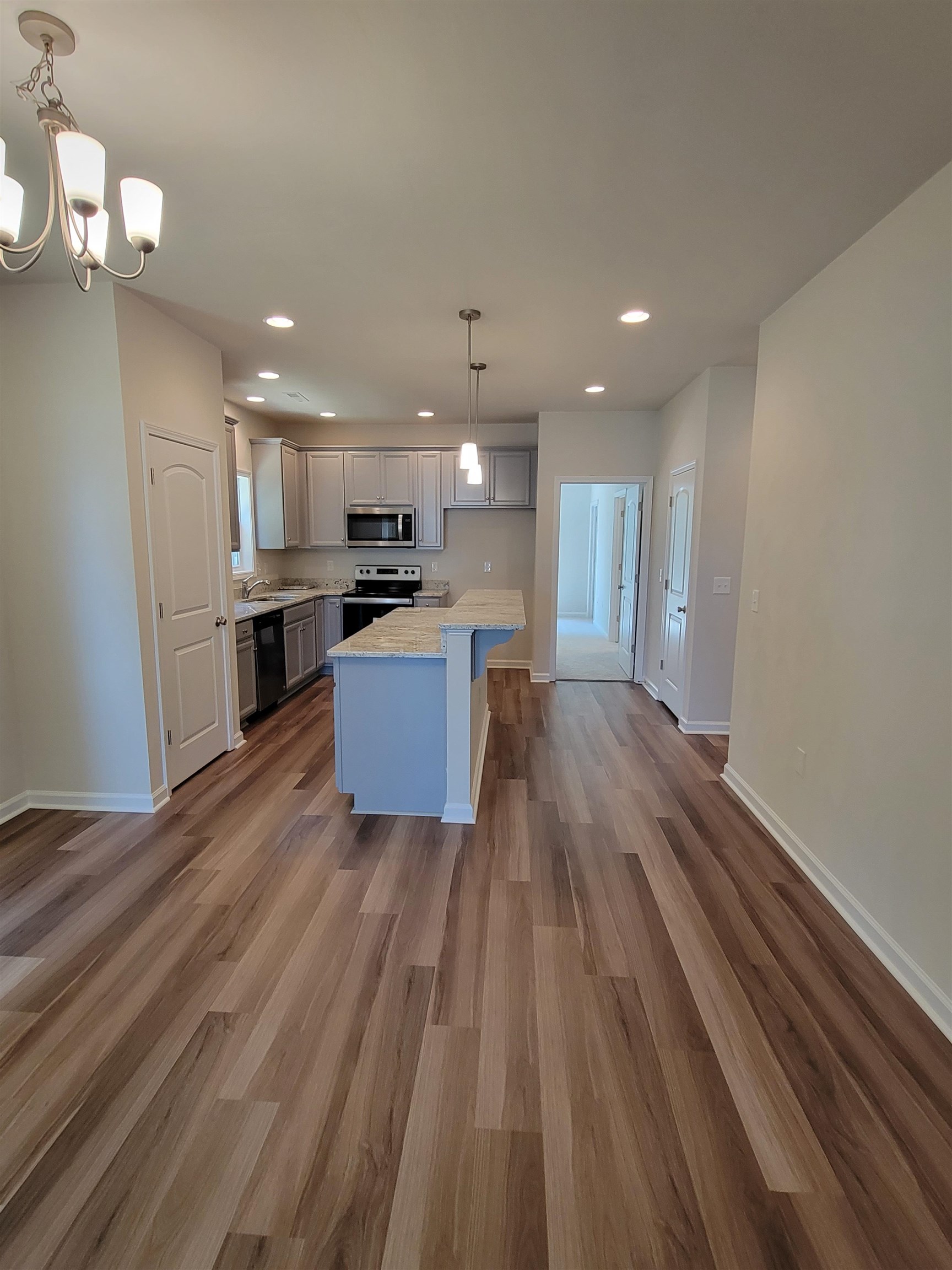 902 New Hope Road Staunton, VA 24401 - Photo 4 of 9 a large kitchen with cabinets wooden floor and stainless steel appliances