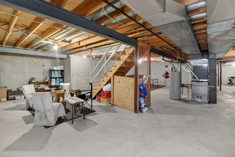 a view of a storage with a table and chairs