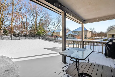 a view of a chairs and table in patio