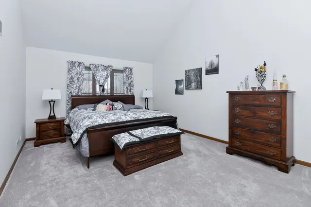 a bedroom with a bed and furniture