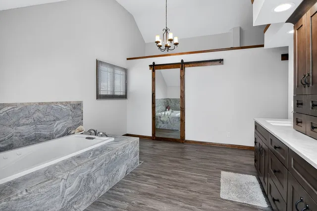 a bathroom with a bathtub and a sink