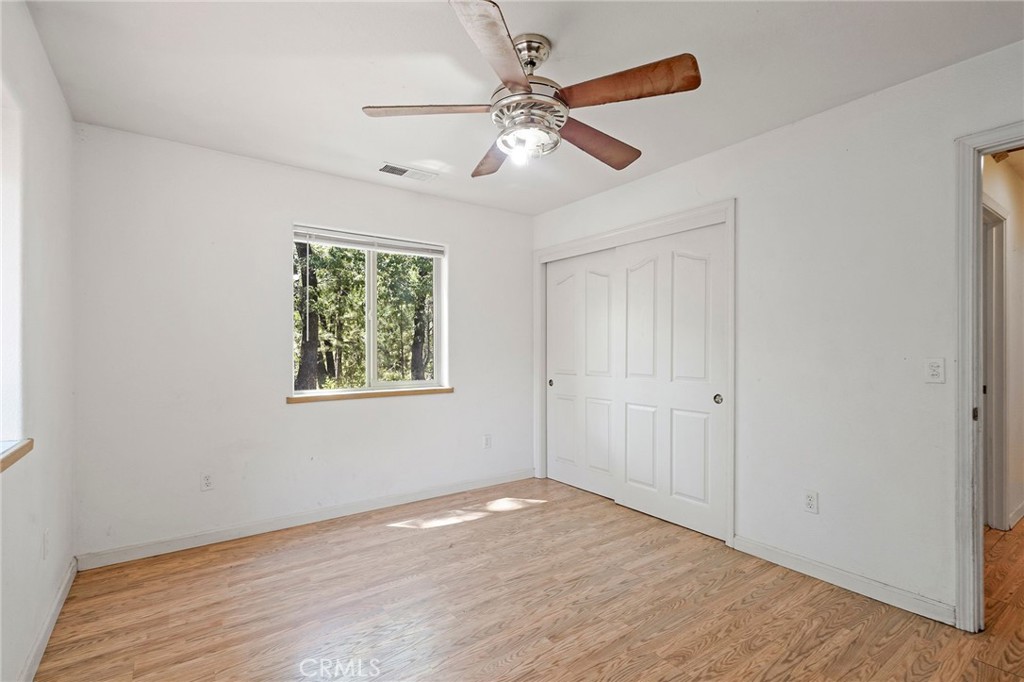 4940 Papya Road Forest Ranch, CA 95942 - Photo 15 of 67 a view of an empty room with window and wooden floor