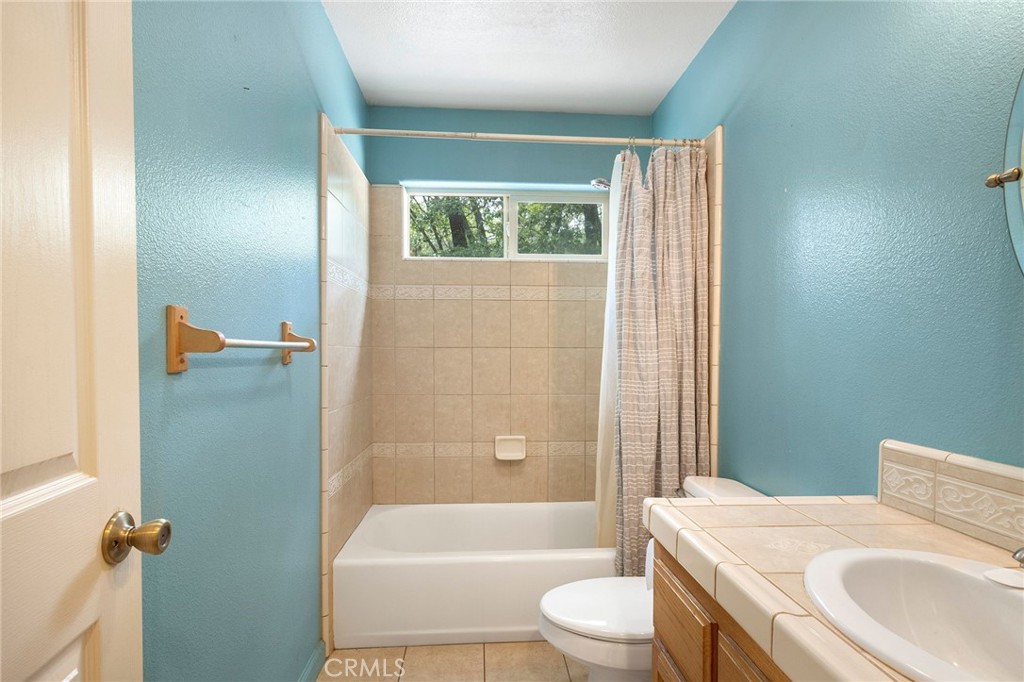 4940 Papya Road Forest Ranch, CA 95942 - Photo 16 of 67 a bathroom with a sink toilet and shower