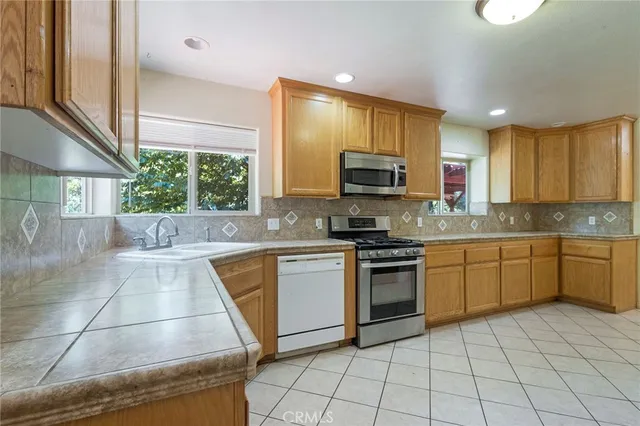 a view of a sink and a window in a kitchen