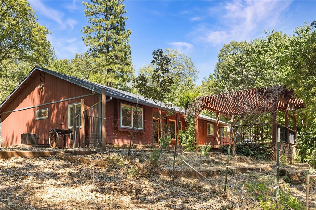 4940 Papya Road Forest Ranch, CA 95942 - Photo 26 of 67 a view of a house with a yard