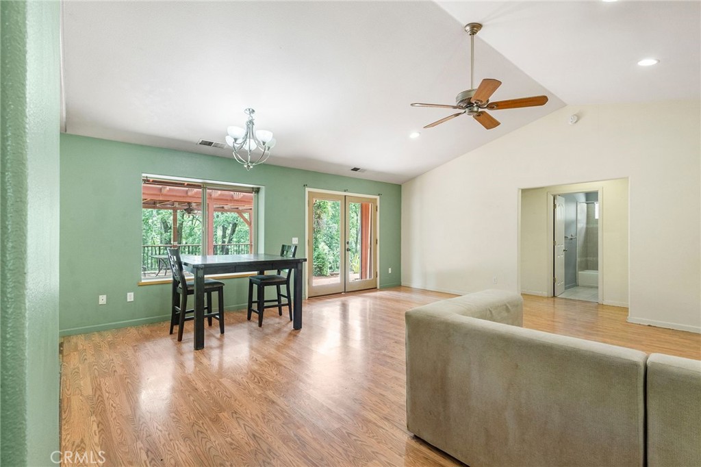 4940 Papya Road Forest Ranch, CA 95942 - Photo 3 of 67 a living room with furniture and a wooden floor
