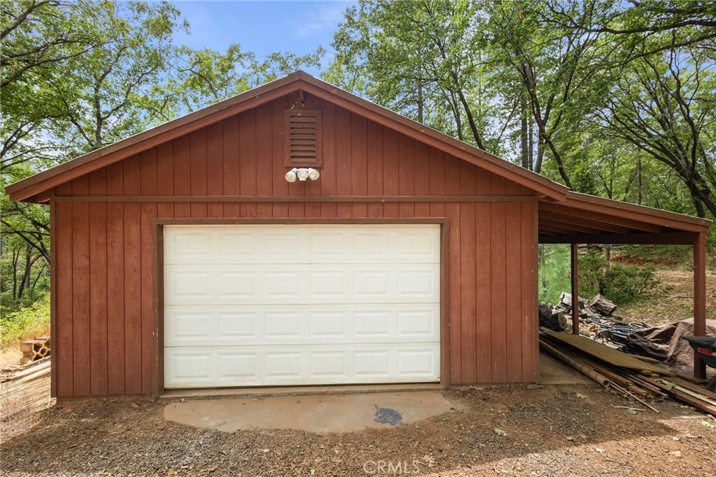 4940 Papya Road Forest Ranch, CA 95942 - Photo 34 of 67 a front view of a house with garden