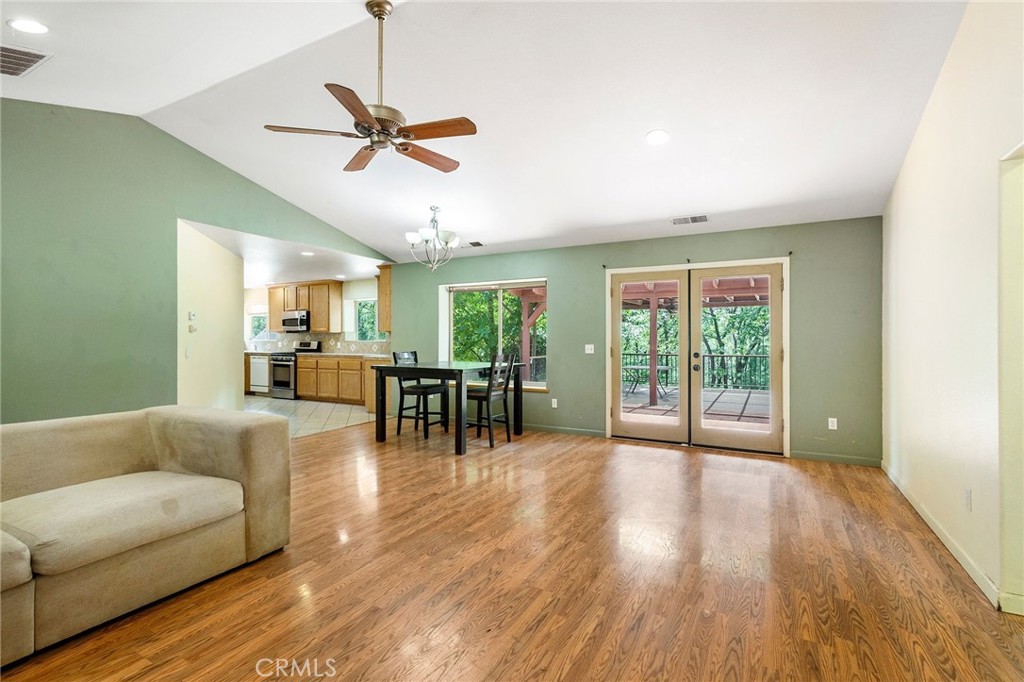 4940 Papya Road Forest Ranch, CA 95942 - Photo 4 of 67 a living room with furniture and a large window