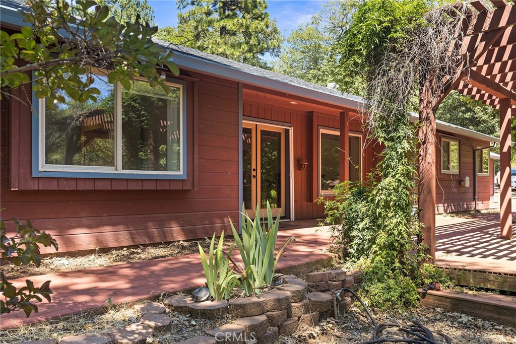 4940 Papya Road Forest Ranch, CA 95942 - Photo 51 of 67 a front view of a house with garden