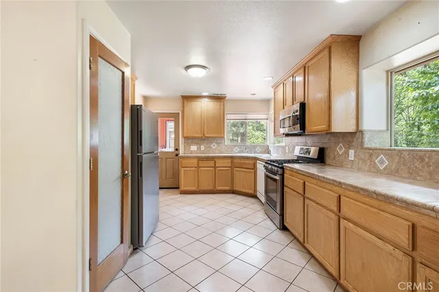 a kitchen with a refrigerator a sink and dishwasher