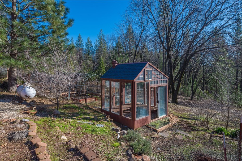 4940 Papya Road Forest Ranch, CA 95942 - Photo 65 of 67 a backyard of a house with lots of green space