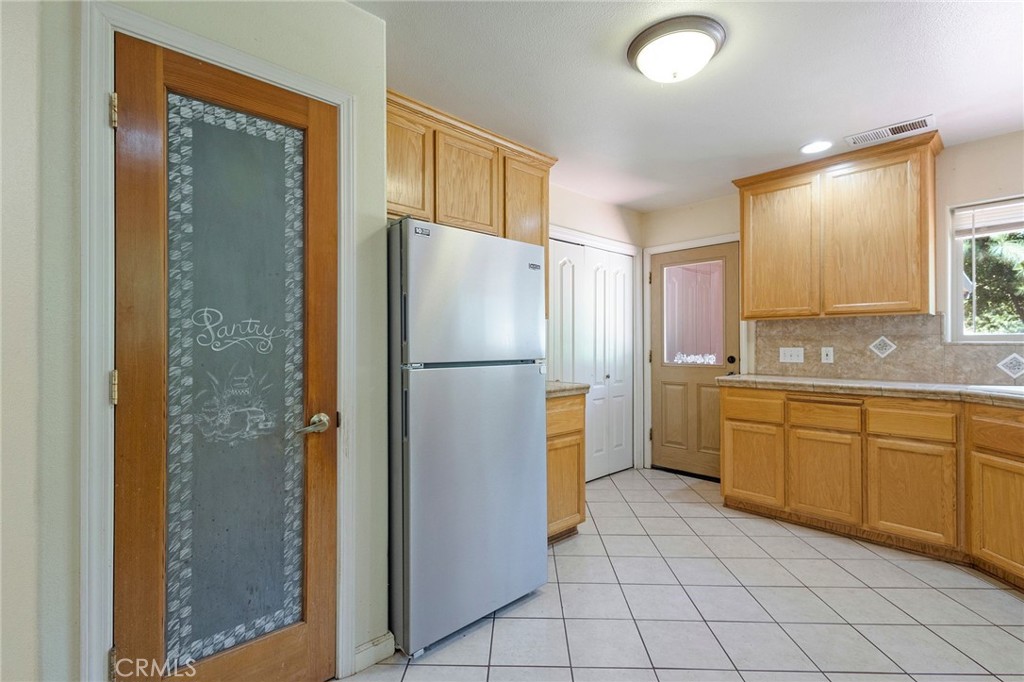 4940 Papya Road Forest Ranch, CA 95942 - Photo 10 of 67 a kitchen with a refrigerator a sink and dishwasher