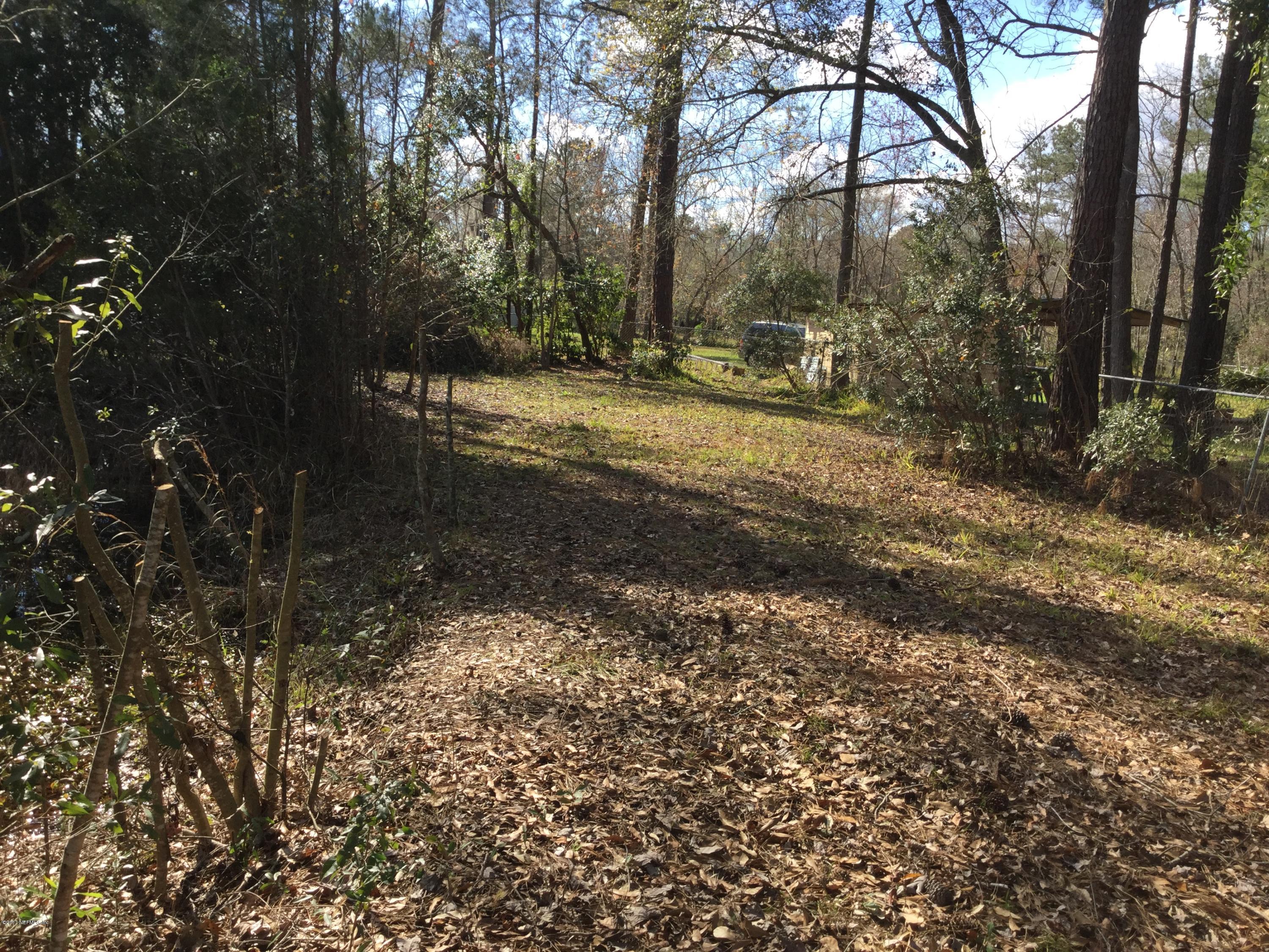 54921 Church Road Callahan, FL 32011 - Photo 3 of 17 a view of a yard with plants and trees