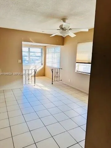 a bathroom with a sink a toilet a mirror and window