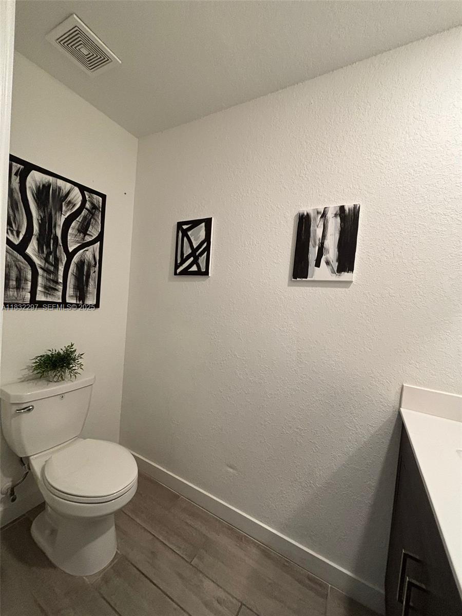 830 Southeast 19th Street Homestead, FL 33034 - Photo 12 of 16 a bathroom with a toilet and a shower