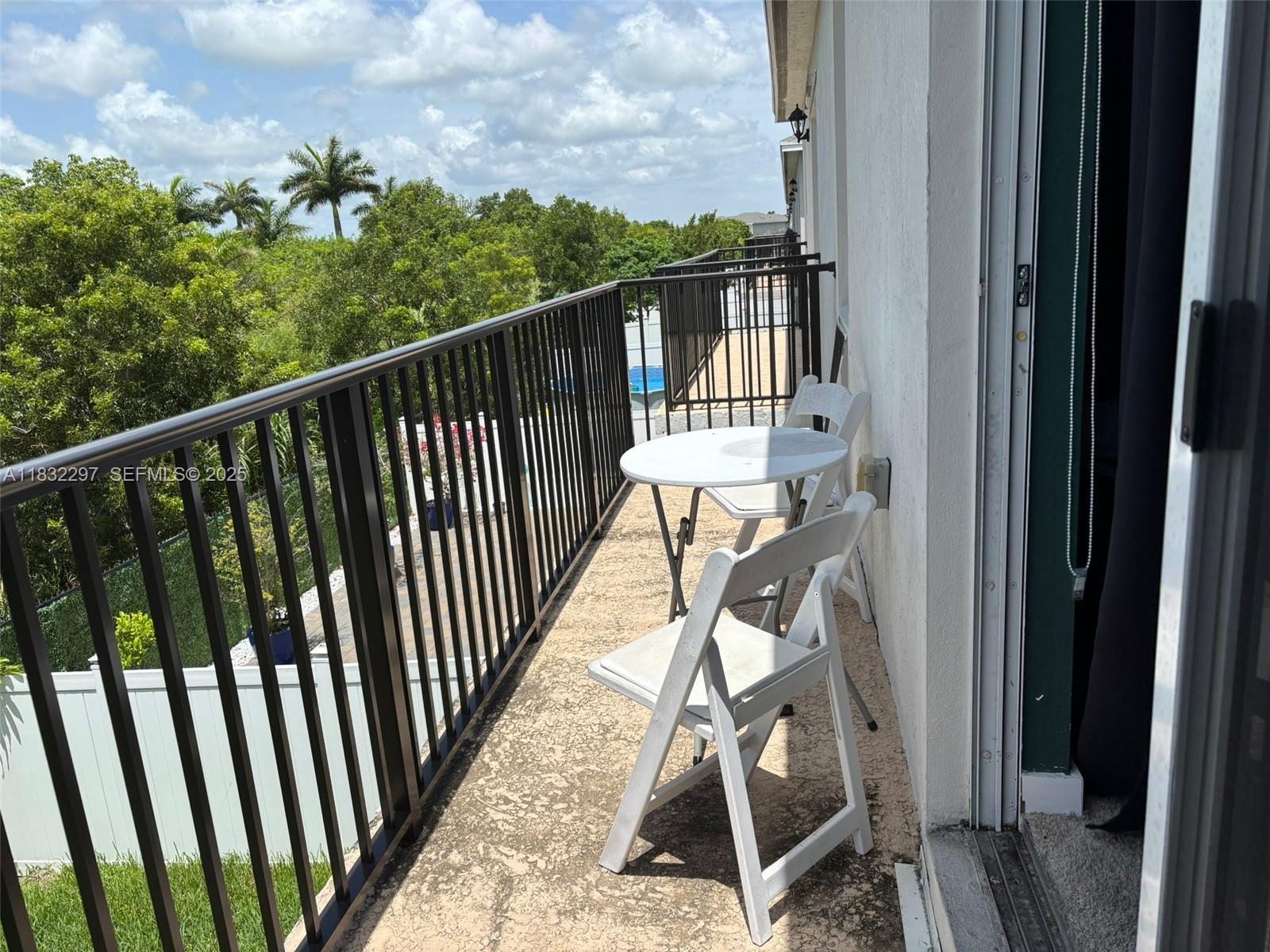 830 Southeast 19th Street Homestead, FL 33034 - Photo 15 of 16 a view of balcony with furniture