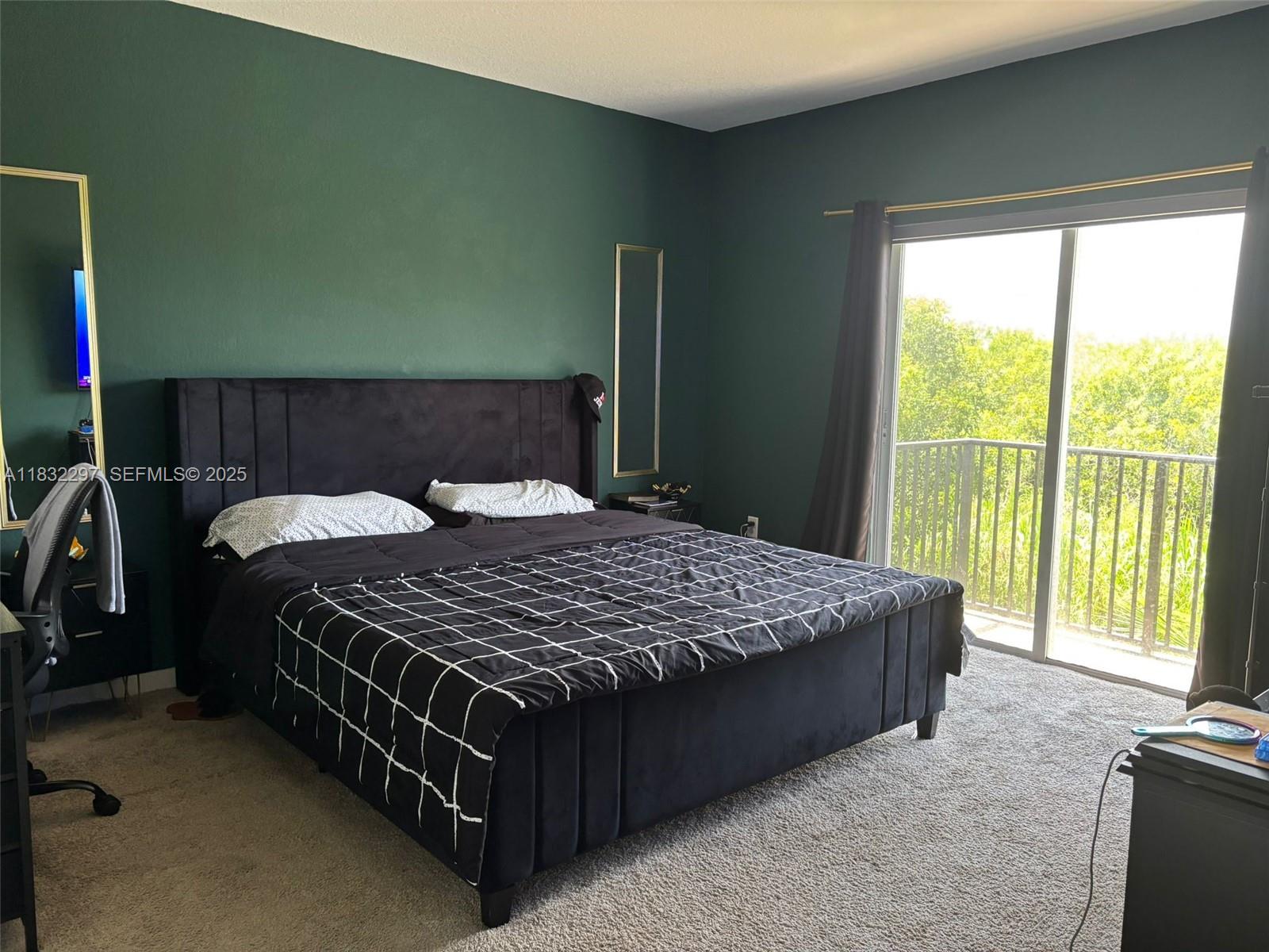 830 Southeast 19th Street Homestead, FL 33034 - Photo 6 of 16 a bedroom with a bed and window