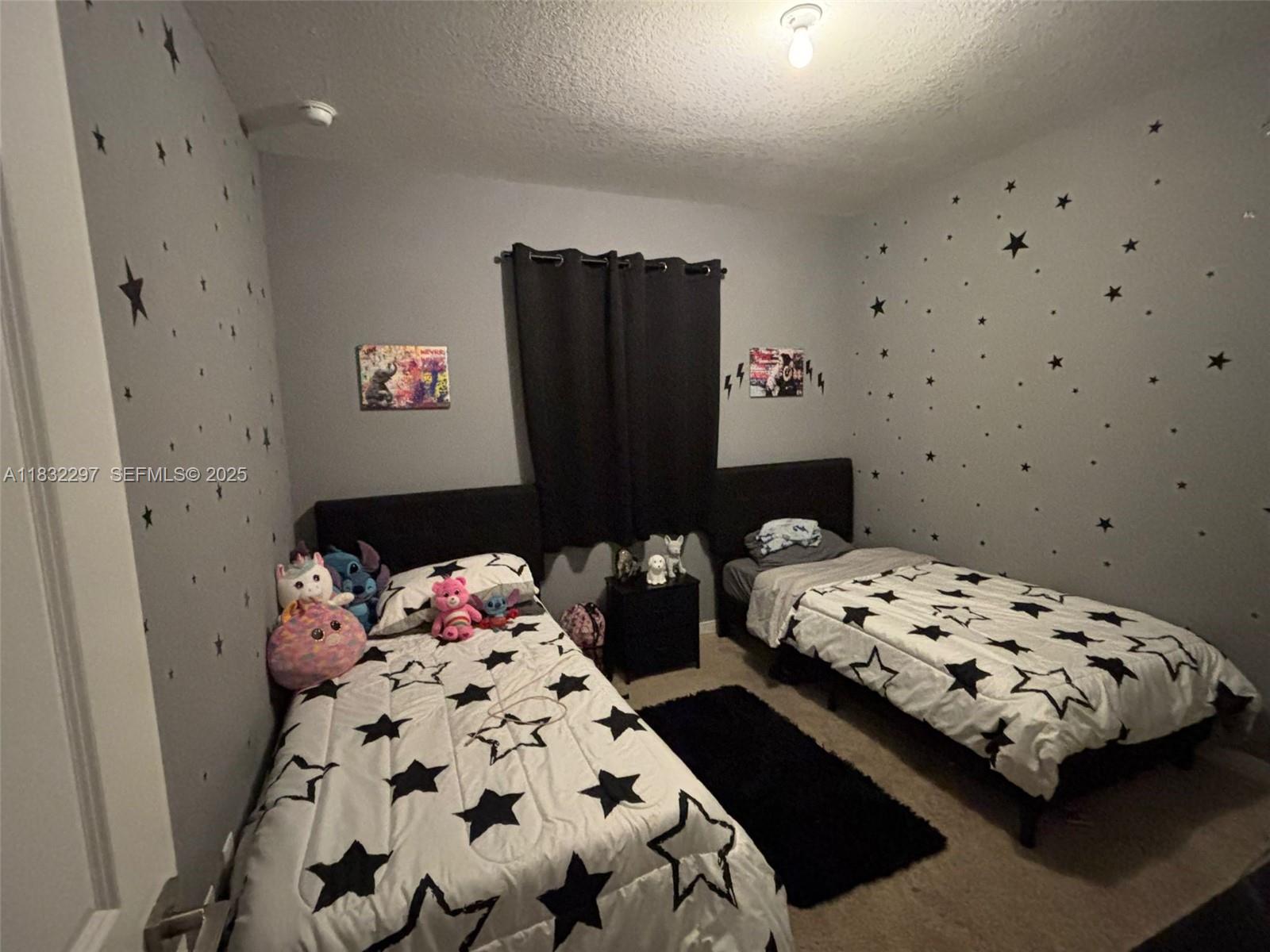 830 Southeast 19th Street Homestead, FL 33034 - Photo 9 of 16 a bedroom with bed and a window