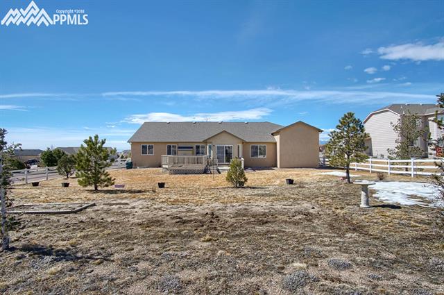 9162 Rockingham Drive Peyton, CO 80831 - Photo 32 of 35 Rear of home. Property is located on nearly a 1/2 acre with NO HOA.
