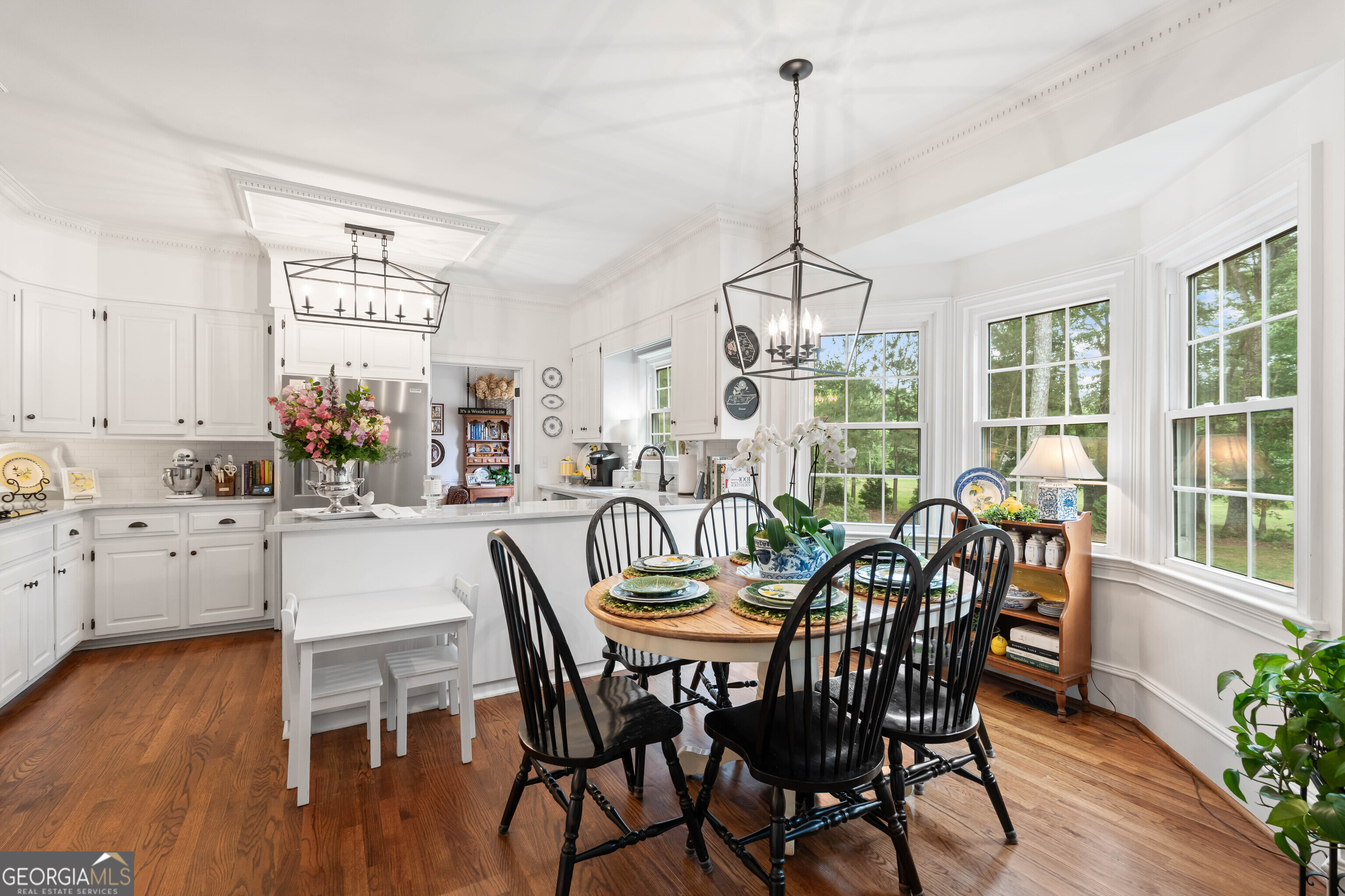 836 Oak Grove Road Carrollton, GA 30117 - Photo 17 of 50 a view of a dining room with furniture window and wooden floor