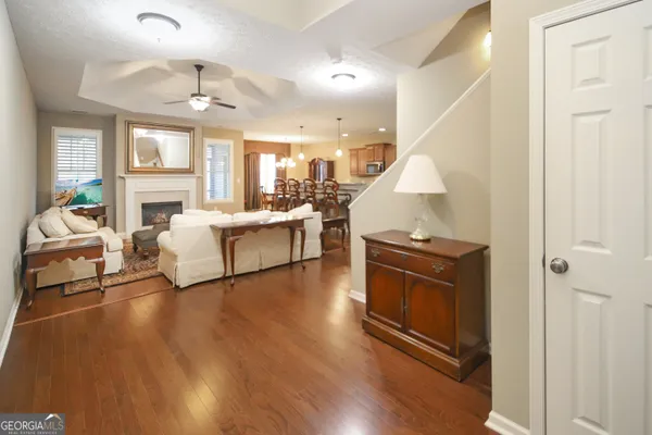 a living room with furniture and a fireplace