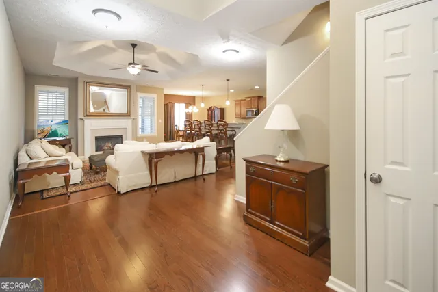 a bedroom with a bed and dresser with mirror