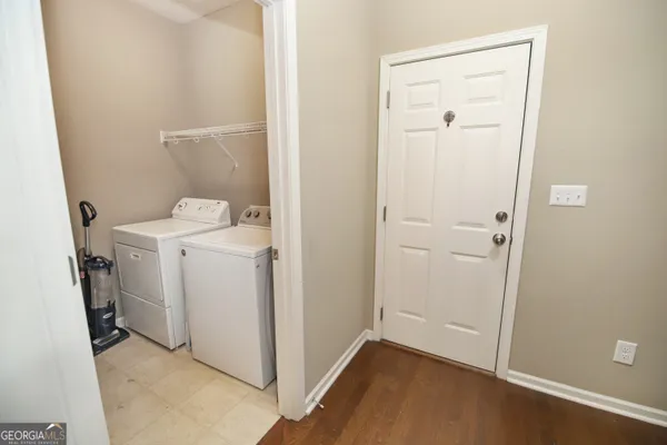 a view of a storage & utility room with a washer dryer