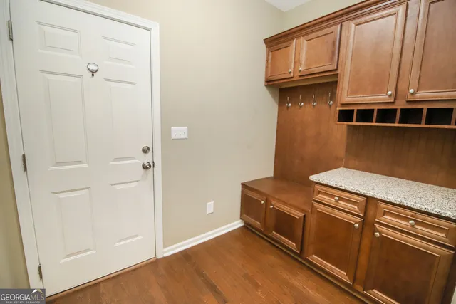 a bathroom with a white tub shower and vanity