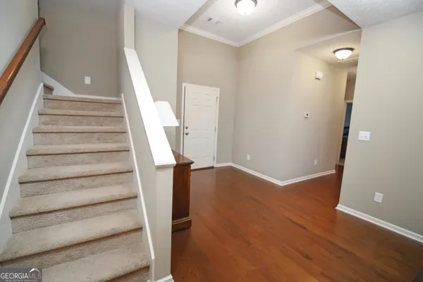 a view of entryway with wooden floor