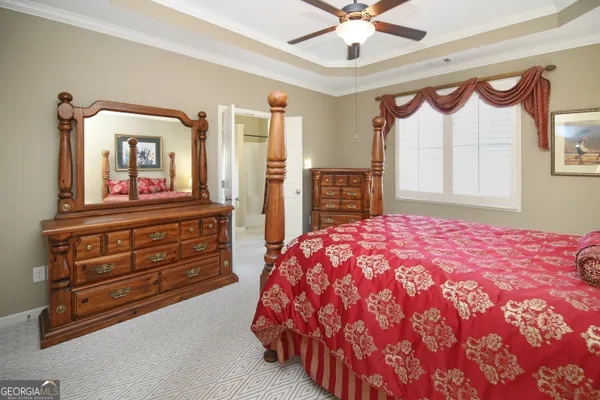 a bedroom with a bed and a large dresser