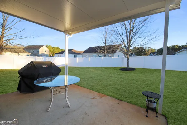 a view of a backyard with furniture