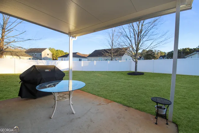 a view of a backyard with furniture