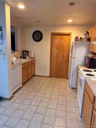 a kitchen with stainless steel appliances granite countertop a sink and cabinets