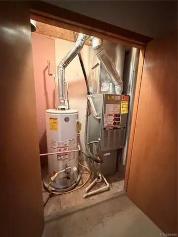 a room with gym equipment and large mirror