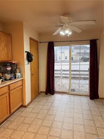 a view of a kitchen with cabinet and a fireplace