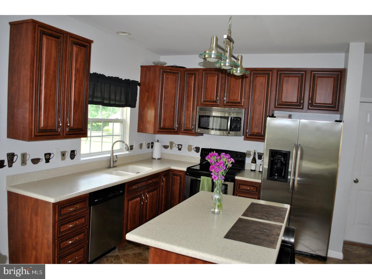 1854 Dixie Line Road Newark, DE 19702 - Photo 8 of 24 a kitchen with granite countertop a sink stainless steel appliances and cabinets