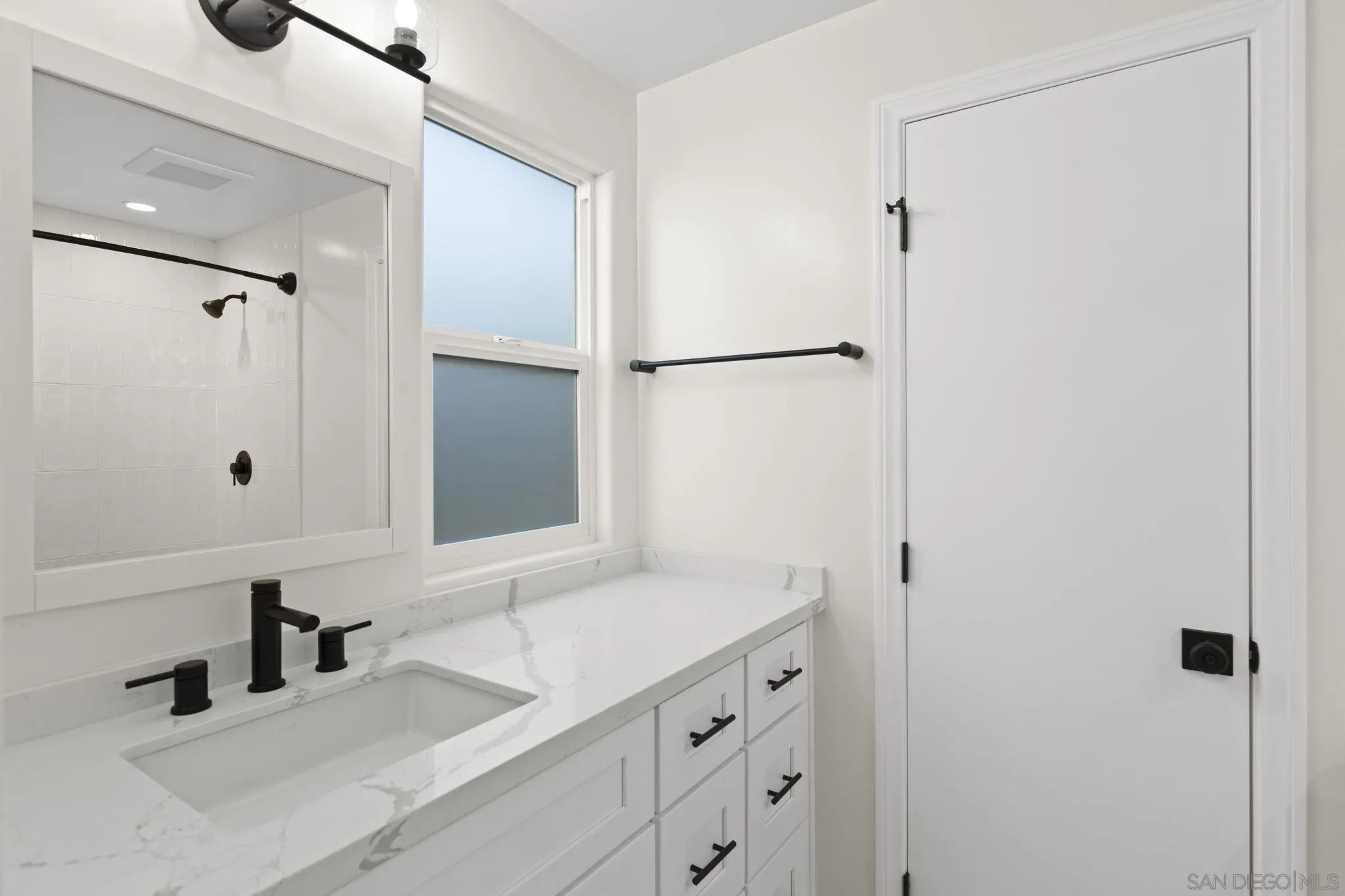 725 Coast S Boulevard La Jolla, CA 92037 - Photo 18 of 23 a bathroom with a sink and a mirror