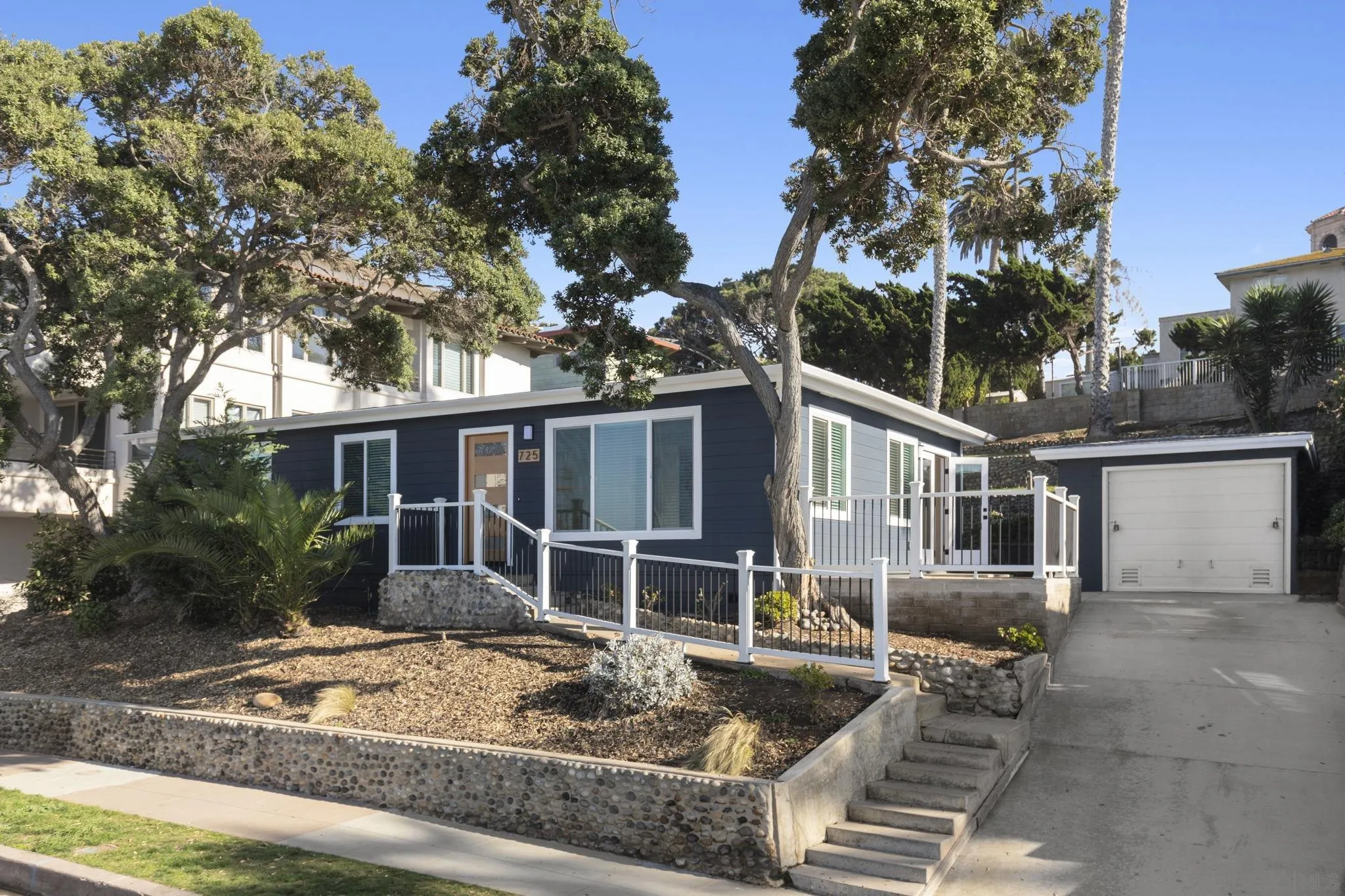 725 Coast S Boulevard La Jolla, CA 92037 - Photo 2 of 23 front view of a house with a yard