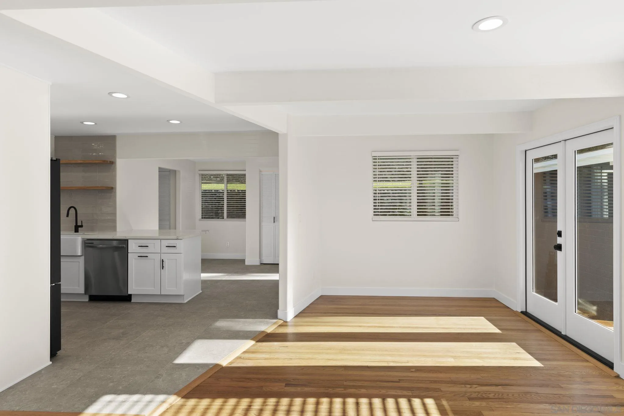 725 Coast S Boulevard La Jolla, CA 92037 - Photo 8 of 23 a view of a kitchen with a sink and dishwasher cabinets