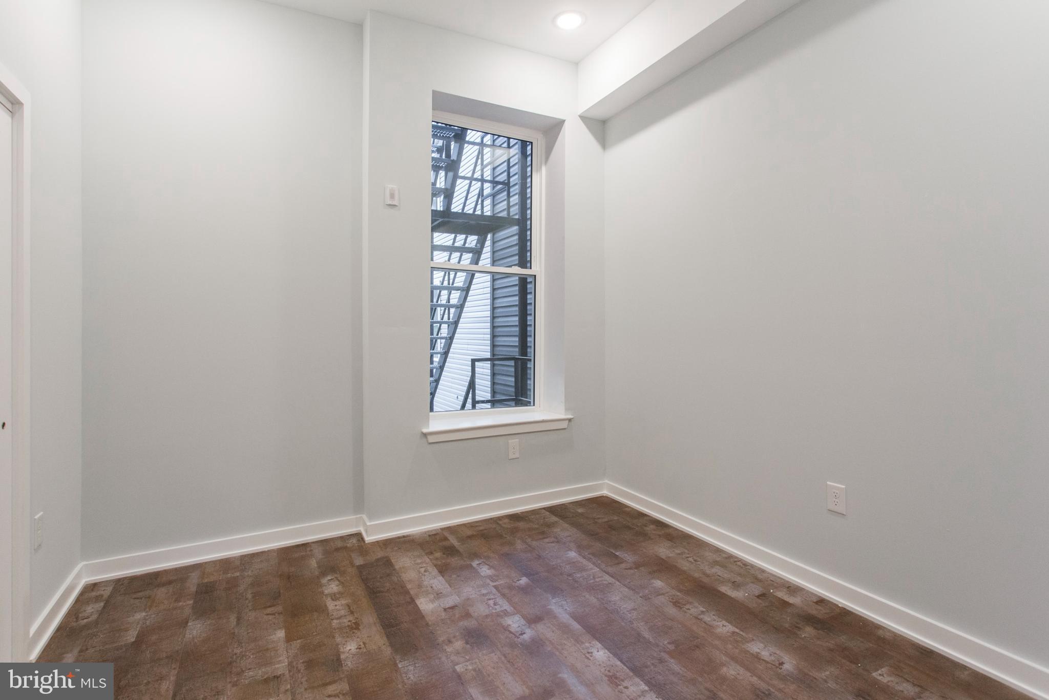 an empty room with windows