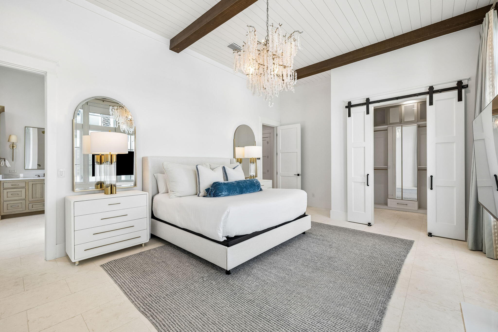 65 A St Inlet Beach Inlet Beach, FL 32461 - Photo 38 of 77 a bedroom with a large bed and a chandelier